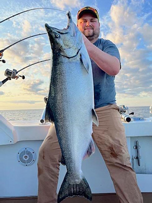 Charter Fishing Algoma WI Man Holding A Salmon