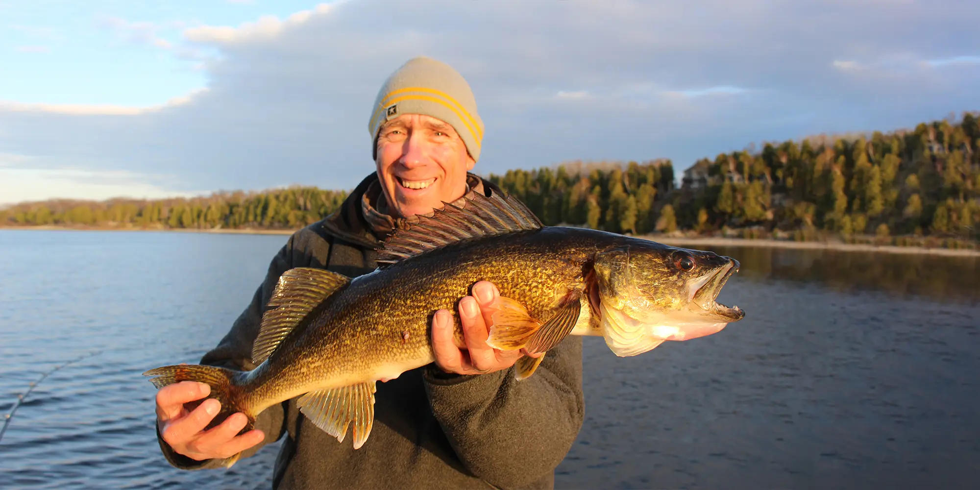 Charter Fishing Sturgeon Bay Man Holding A Walleye