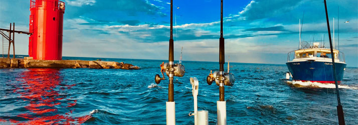 Lake Michigan Fishing Charters Boat Near A Lighthouse