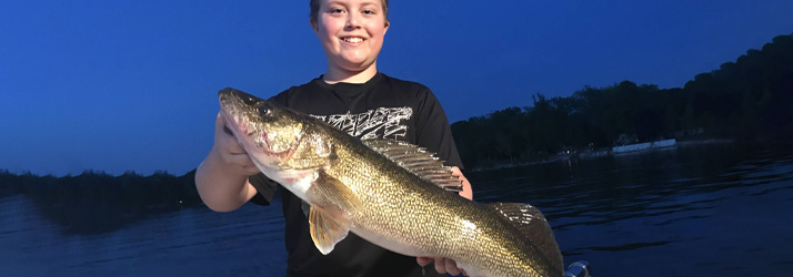 Lake Michigan Fishing Charters Boy Holding A Walleye