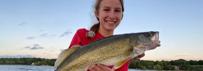 Lake Michigan Fishing Charters Girl Holding A Walleye