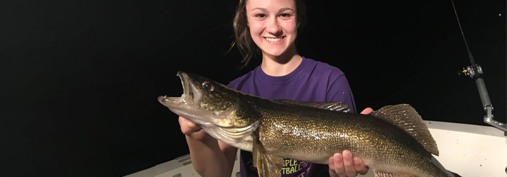 Lake Michigan Fishing Charters Girl Holding A Walleye