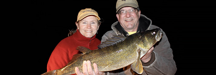 Lake Michigan Fishing Charters Happy Couple Holding A Walleye