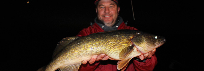 Lake Michigan Fishing Charters Man Holding A Walleye