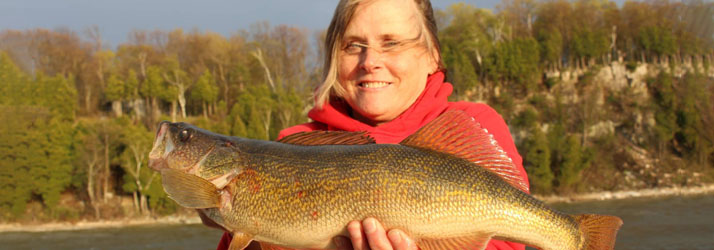 Lake Michigan Fishing Charters Woman Holding A Walleye