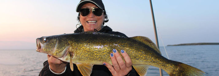 Lake Michigan Fishing Charters Woman Holding A Walleye